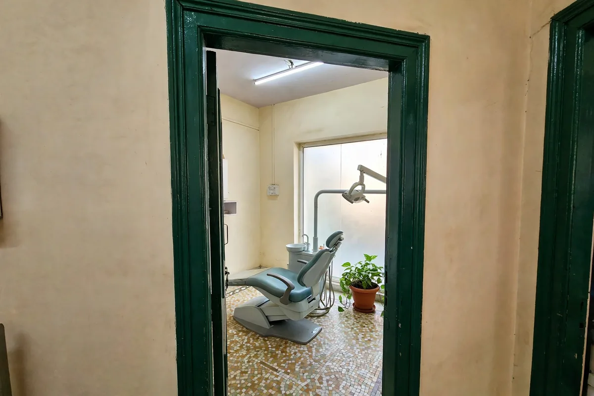 A second treatment room, seen through the doorway